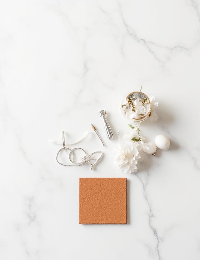 Artisan tools on a clean marble surface representing precision and clarity